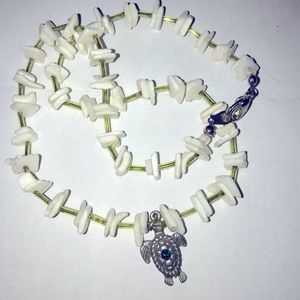 Small white shell with turtle charm necklace.